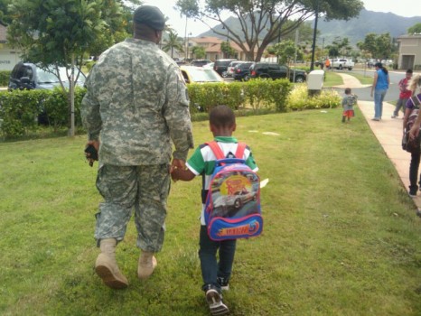 My husband walking my son to school the day before he deployed.