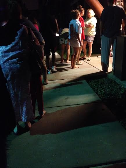 Resort guests standing outside after fire alarm goes off.